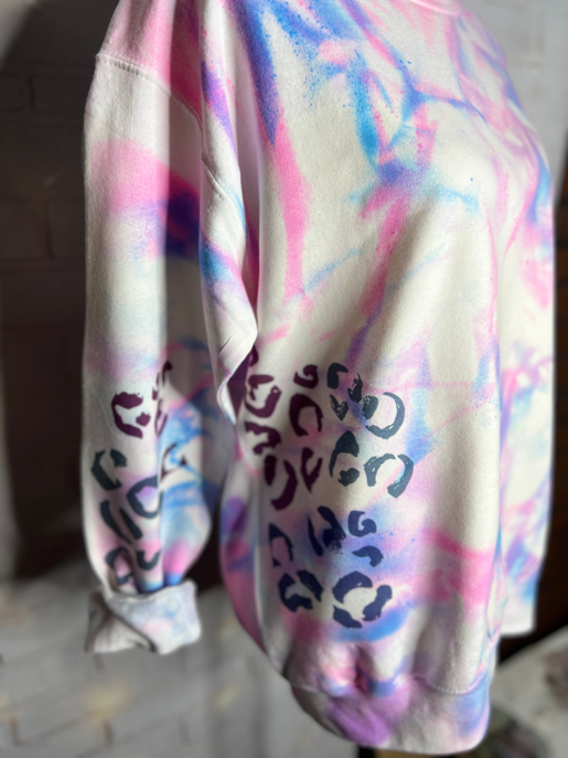 Side view neon tie-dye sweatshirt with leopard-print graphic on sleeve cuff