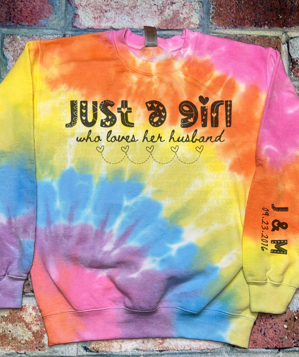 Colorful tie-dye crewneck sweatshirt with 'Just ... husband' graphic front