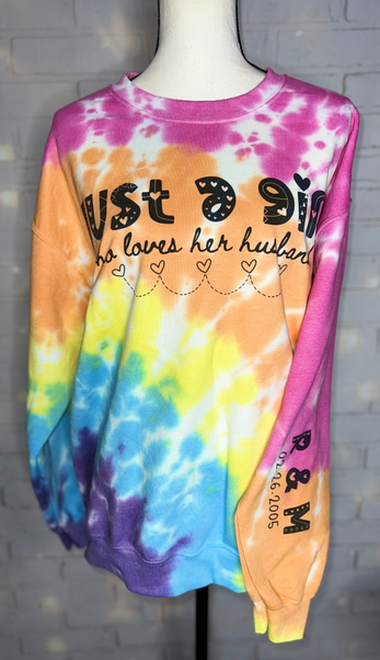 Tie-dye crewneck sweatshirt on mannequin with 'Just ... husband' text and graphic