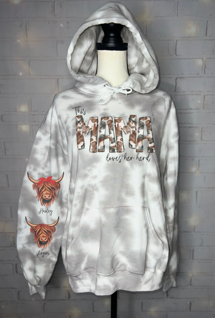 White hoodie with front pocket, hood, and “loves her herd” graphic with sleeve print