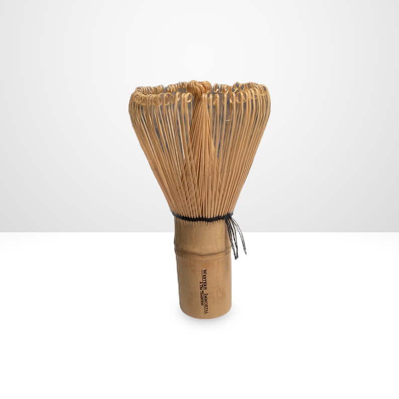 Bamboo matcha tea whisk with tied bundle of tines and cylindrical wooden handle