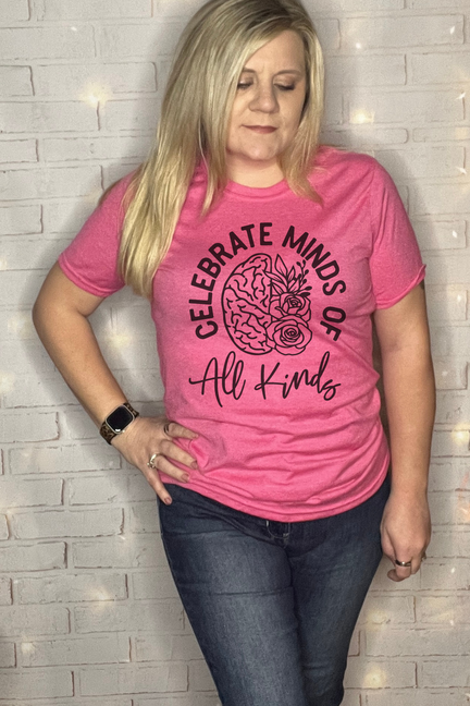 Pink graphic T-shirt with 'Celebrate Minds of All Kinds' brain-and-rose print