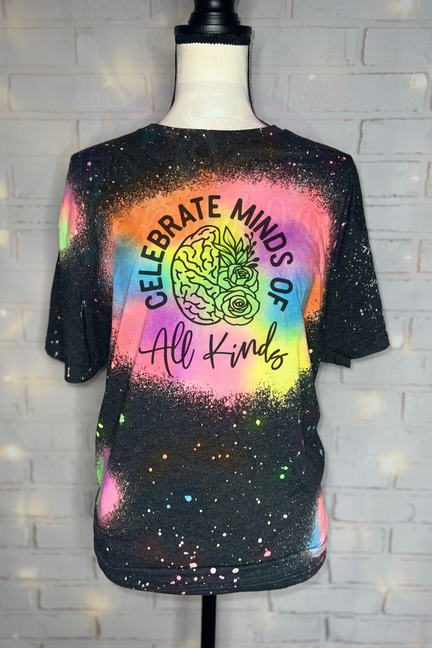 Black galaxy splatter T-shirt with colorful 'Celebrate Minds of All Kinds' brain-rose print