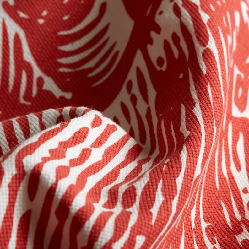 Close-up of shower curtain fabric with red-and-white lobster print texture