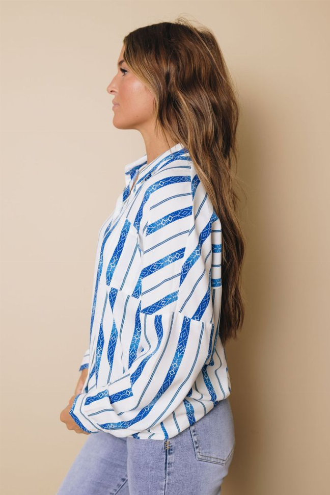 Button-down shirt in blue-and-white stripes, side profile, collared long sleeves