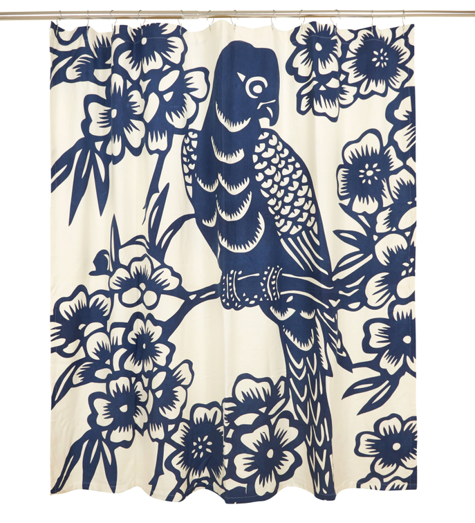 Shower curtain panel featuring navy parrot illustration and blooming flowers on cream.