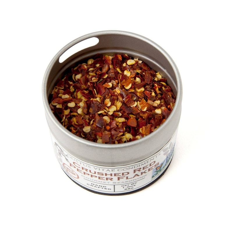 Salt-free seasoning tin filled with dark red chili and herb flakes