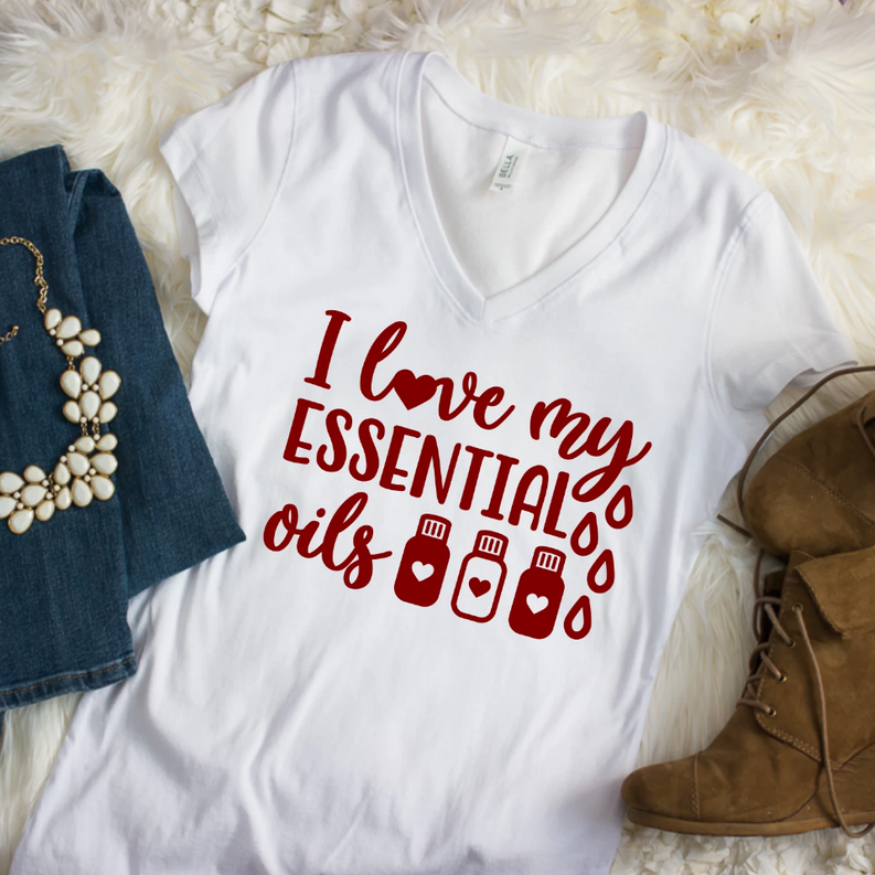 Ladies white V-neck tee with red "I love my Essential Oils" graphic