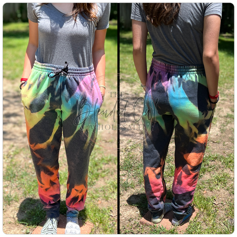 Rainbow burst tie-dye joggers with elastic waistband, drawstring, and tapered cuffs