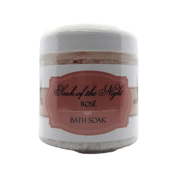 Bath soak jar with white lid and pink Soak of the Night Rosé label