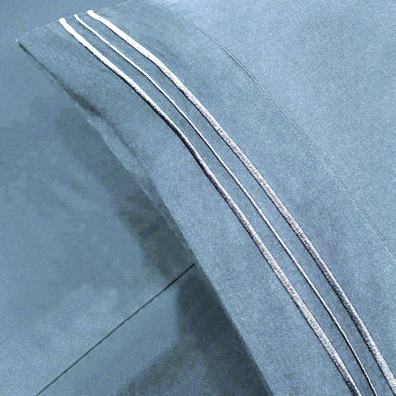 Light blue embroidered stripe fabric detail on sheet set