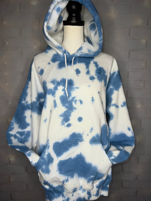 White and blue tie-dye pullover hoodie with drawstring hood and front pouch