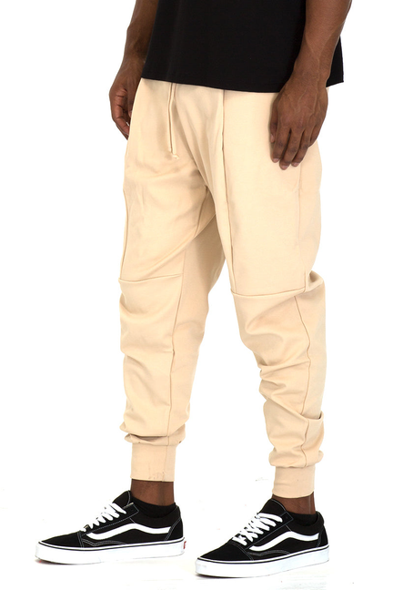 Khaki front-pleat sweat pants with elastic cuffs and drawstring waist