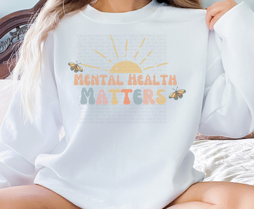 Light blue crewneck sweatshirt with Mental Health Matters front graphic and butterfly