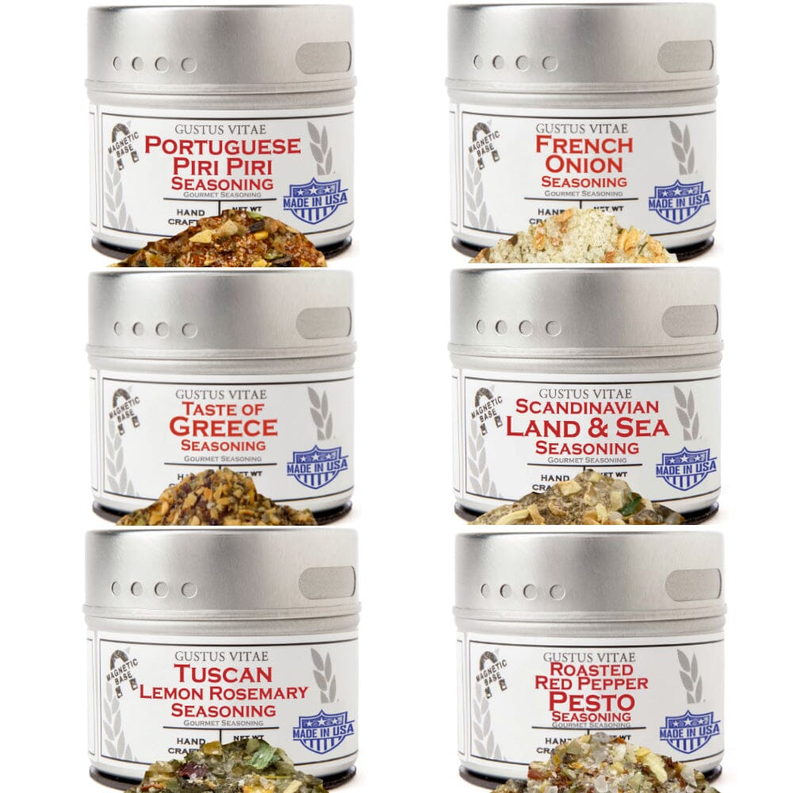 Six spice blend jars with colorful labels and silver screw-top lids