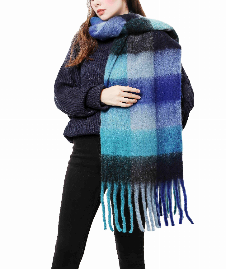 Plaid blanket scarf with fringed ends, blue and teal blocks over dark base