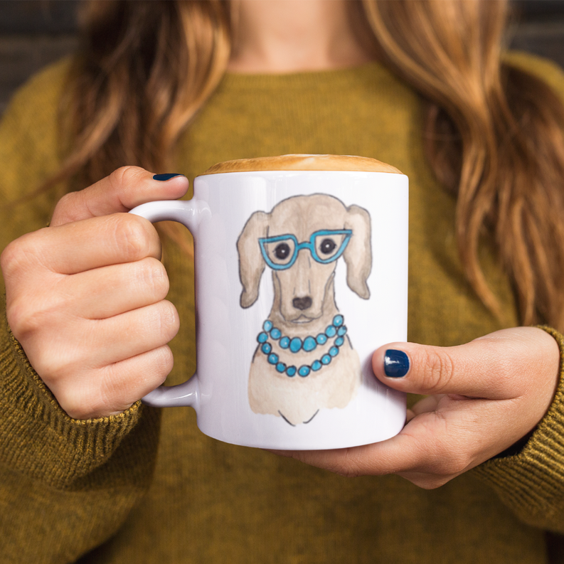 Ceramic mug with illustrated dog wearing blue glasses and beaded blue collar