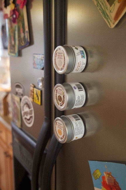 Gourmet seasoning tins lined on a shelf