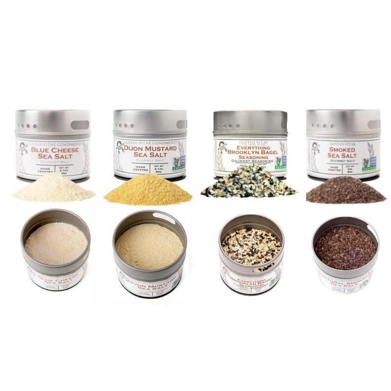 Set of four seasoning tins with assorted powder piles