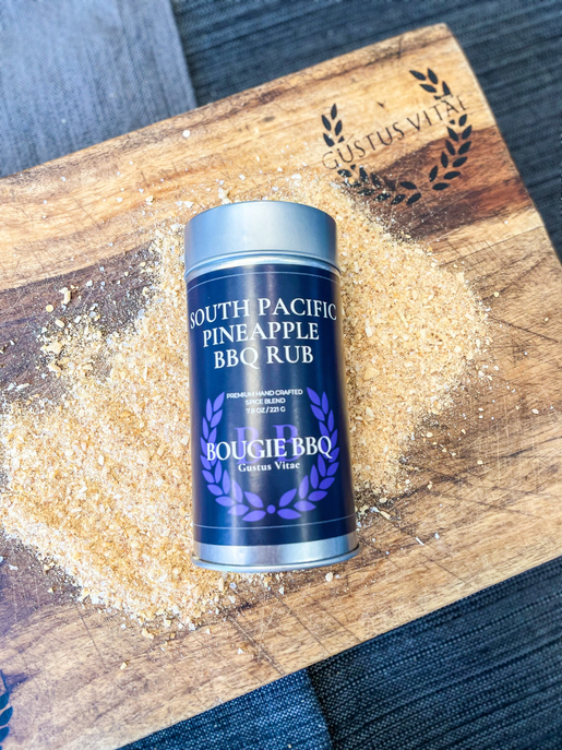 South Pacific pineapple BBQ rub canister on wooden board