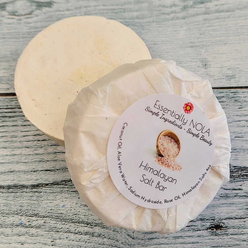 Round Himalayan salt soap bar wrapped in kraft paper with brand label