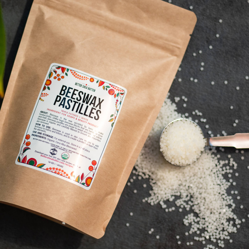 Beeswax pellets bag with scattered white wax beads, 100% pure