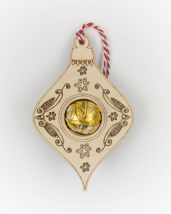 Diamond-shaped truffle candy holder ornament with gold filigree and red-and-white striped twine