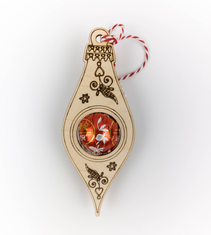 Teardrop truffle candy holder ornament with gold design and red-and-white striped hanging twine