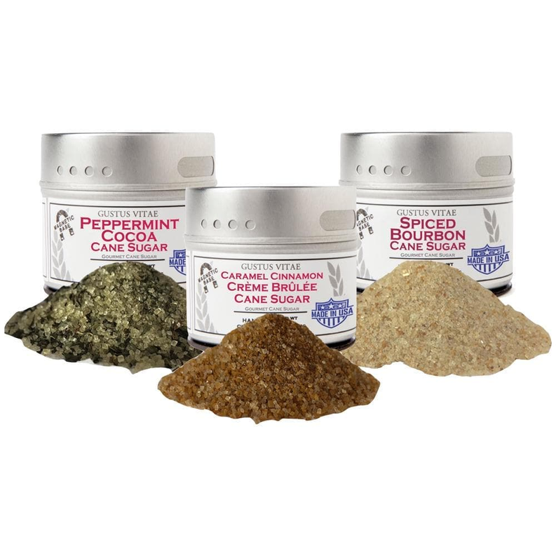 Set of 3 flavored cane sugar jars with three piles of brown granulated sugar