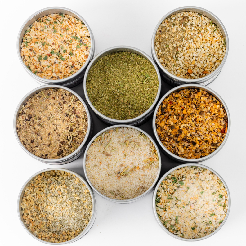 Gourmet seasoning tins set with 8 open round jars of mixed herbs and salts