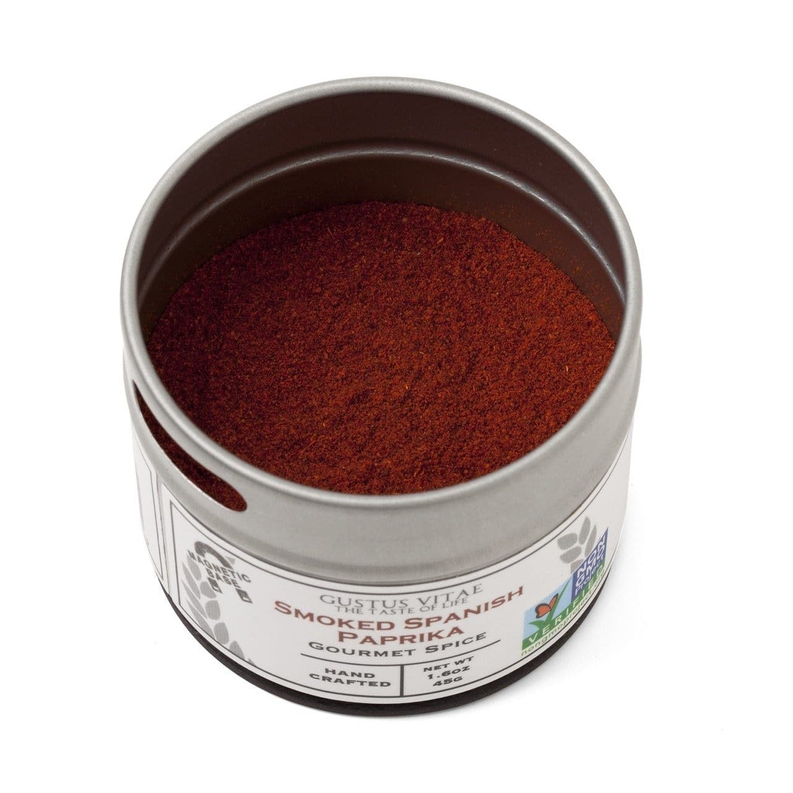 Smoked Spanish paprika tin opened, filled with finely ground red spice