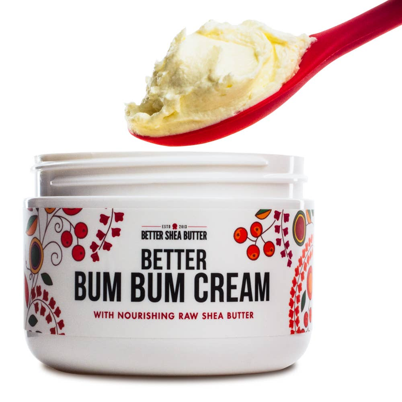 Skin-toning lotion jar with raw shea butter shown on a red spoon