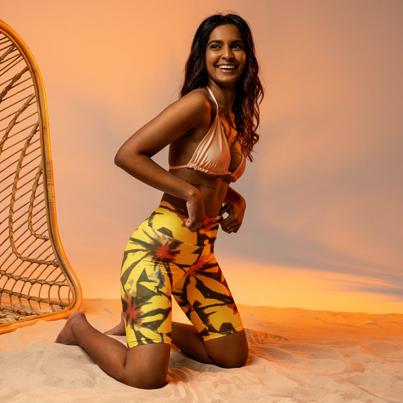 Biker shorts with yellow and red tie-dye pattern, mid-thigh length