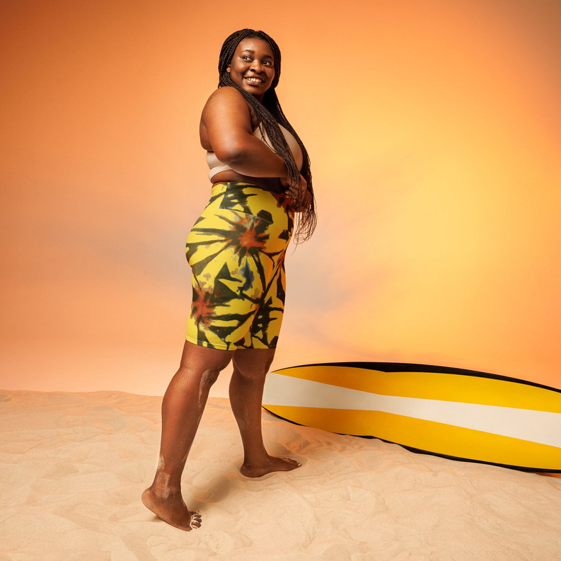 Yellow tie-dye biker shorts, mid-thigh length, front-left view