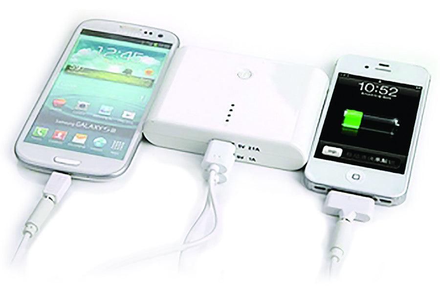 White power bank charging three smartphones with USB cables