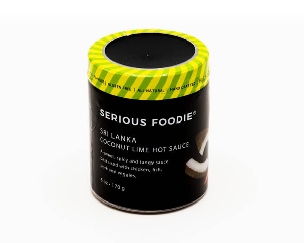 Coconut lime hot sauce canister with black label and green checked lid