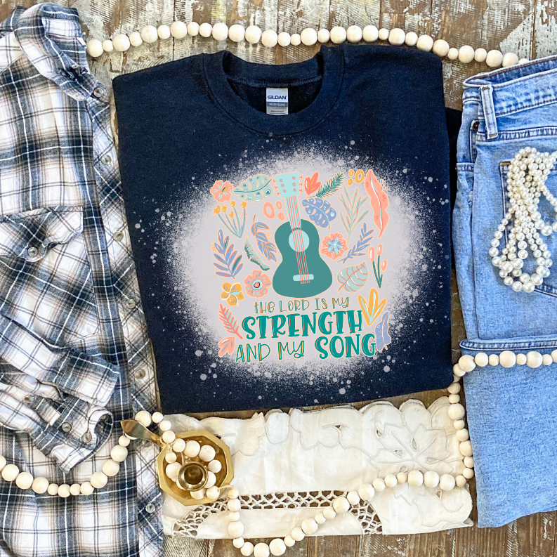 Navy crewneck tee with colorful floral 'Lord is My Strength and My Song' graphic
