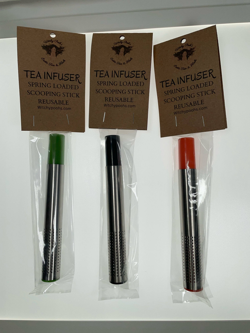 Tea stick infusers in packaging, perforated metal sticks with black and orange ends