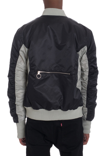 Two-tone bomber jacket, back view, black with light gray panels and ribbed cuffs