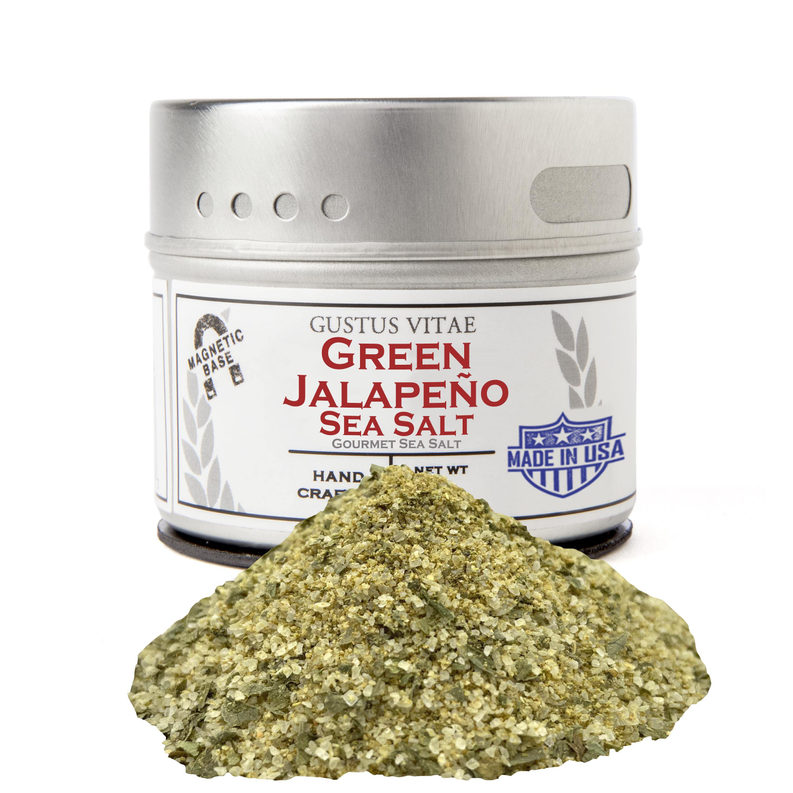 Jalapeño green sea salt in a jar with a mound of coarse seasoning