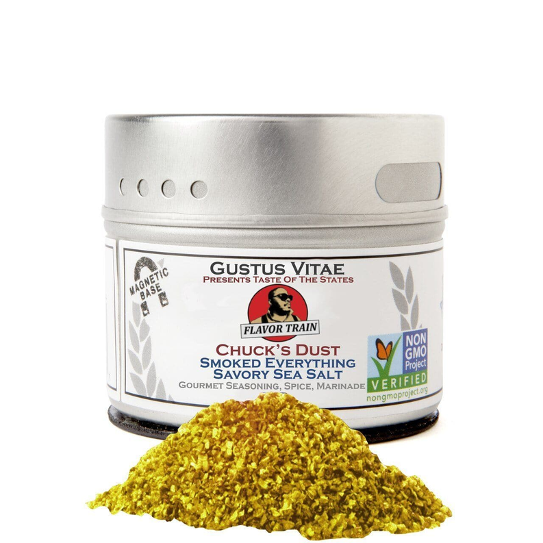 Metal tin of smoked savory sea salt with mound of yellow seasoning
