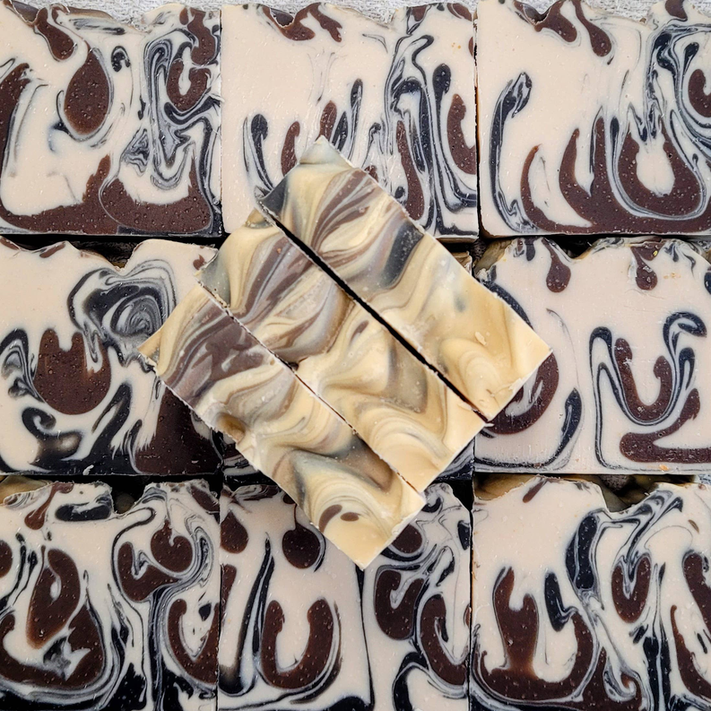 Swirled cream and cocoa soap bars in a molded pattern