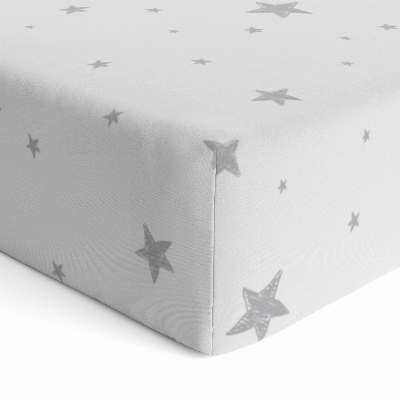 Flannel fitted crib sheet corner view, light gray with star print and elastic edge