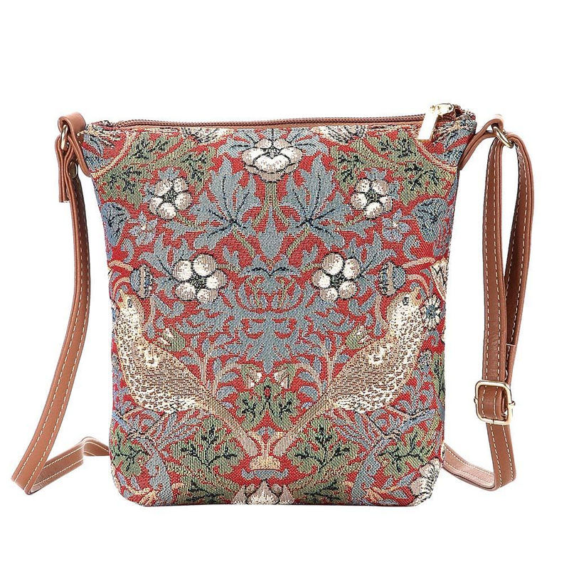 Red and green floral tapestry crossbody sling bag with top zip and brown leather straps