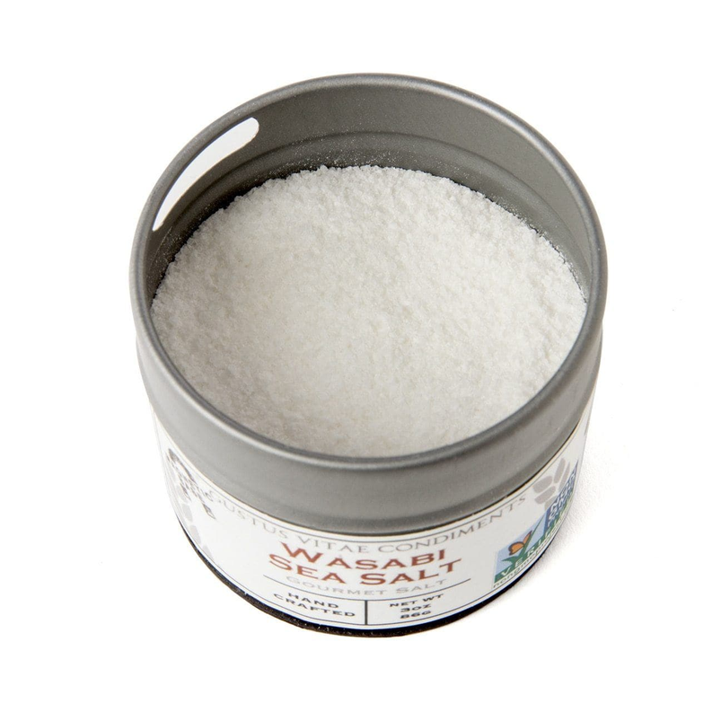 Open round tin with pale white salt granules, silver rim