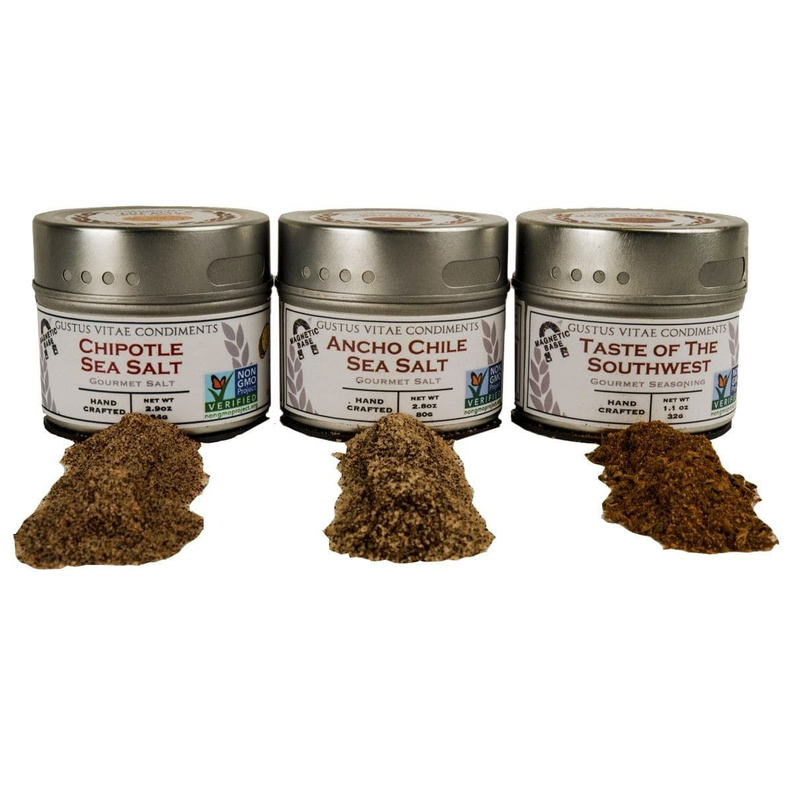 Three spice tins with matching mounds of ground seasoning