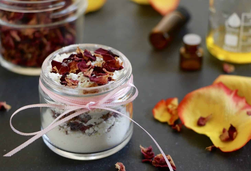Small jar filled with dried red rose petals
