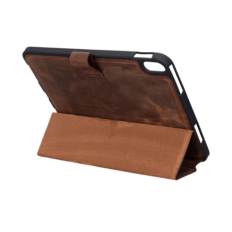 Brown leather folio case open, propped up as a stand.