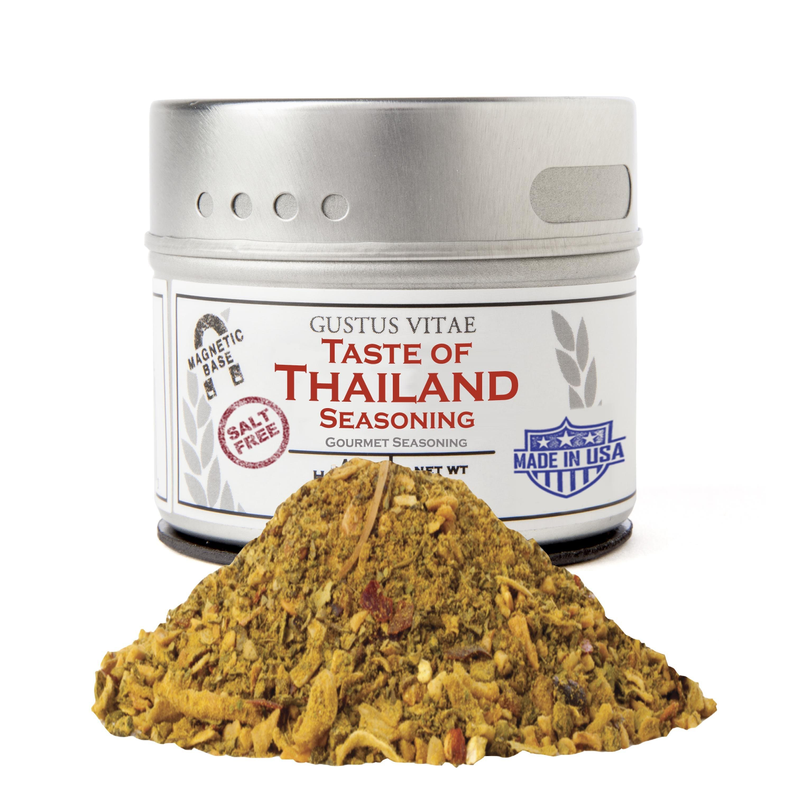 Thai seasoning tin with silver lid and loose yellow-brown seasoning pile in front