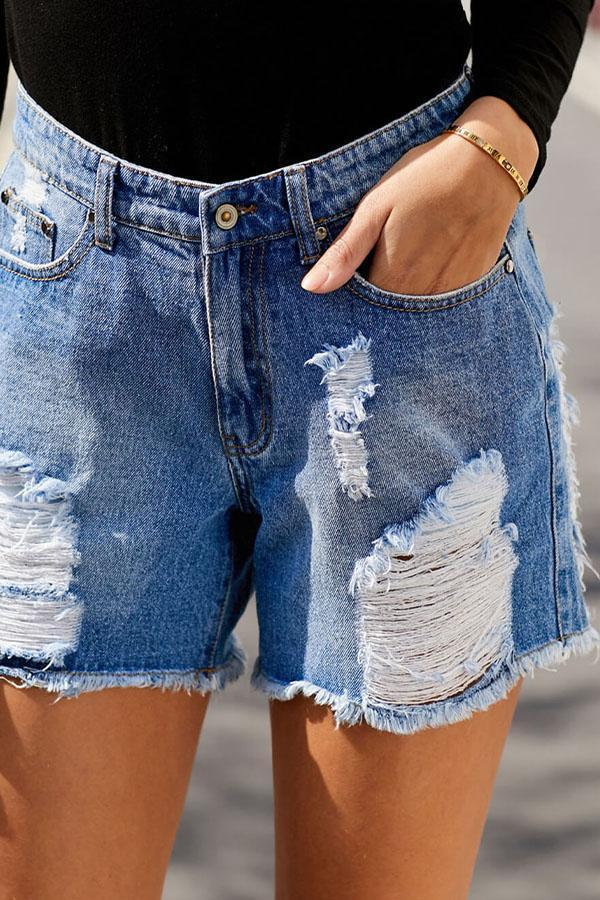 Distressed denim shorts, light wash, ripped patches and frayed cuffs